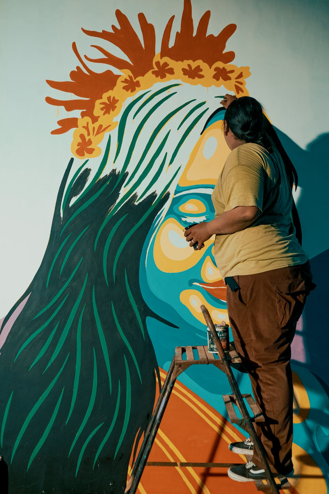 street artist painting mural