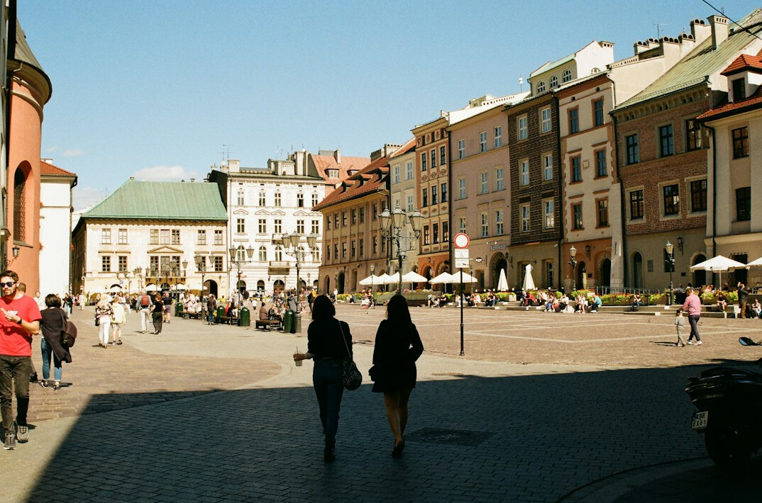 woman crossing city square